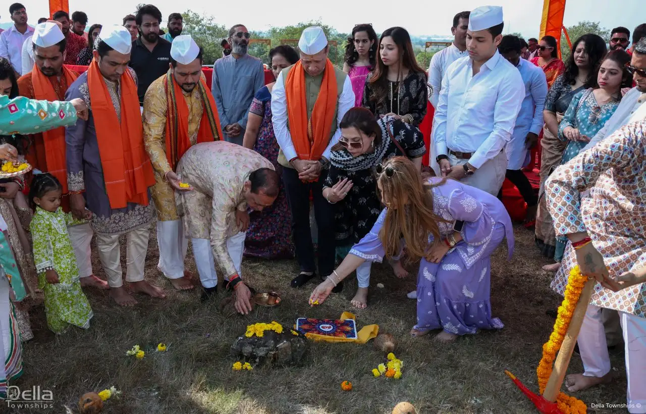 Guests and team members gathered for the Bhumi Poojan ceremony at Della Racecourse Pune site