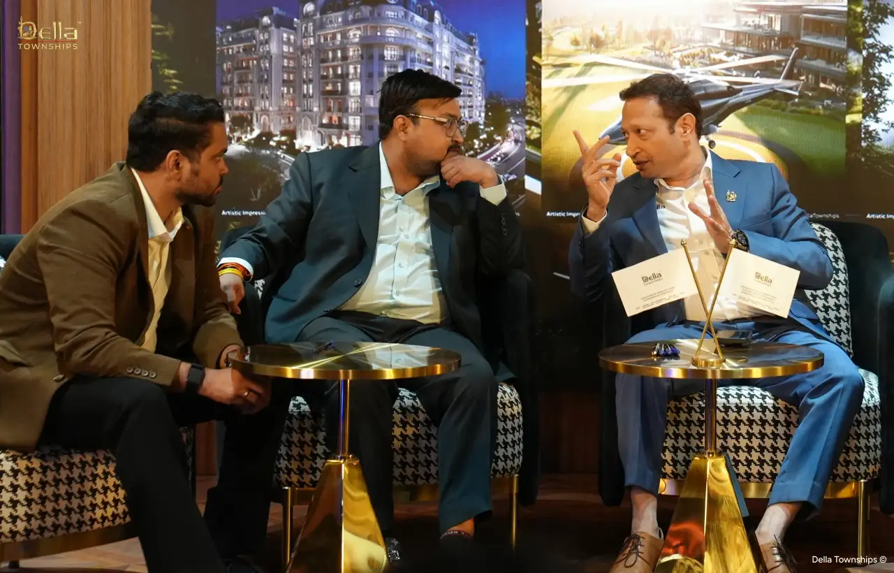 Leadership discussion during Della Townships Ahmedabad signing event with executive team and partners