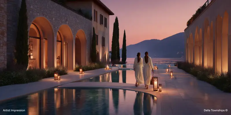 Luxury wellness spa courtyard with reflection pool and serene evening ambiance at Della Townships