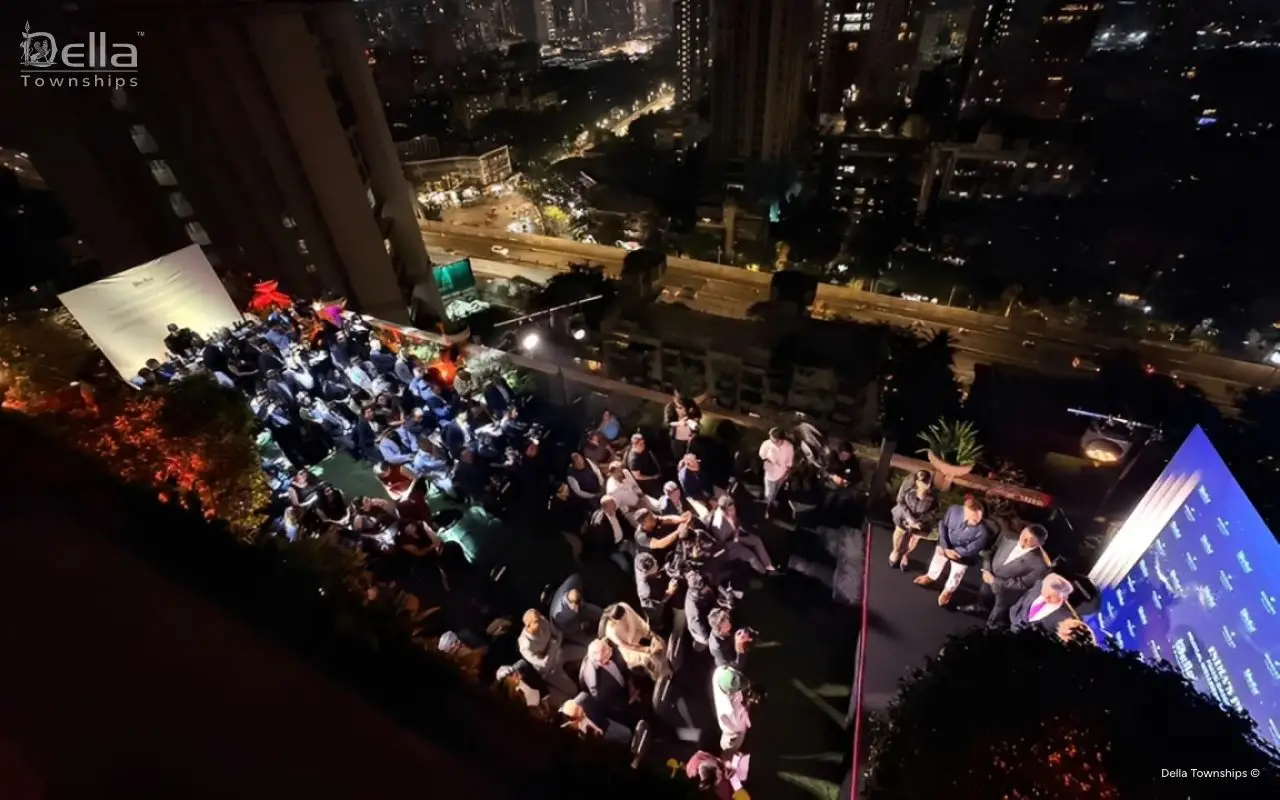 Rooftop launch event by Della Townships with city skyline backdrop