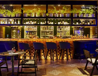 Stylish outdoor bar counter setup for destination wedding reception