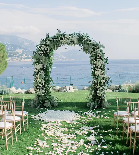 Elegant outdoor township wedding venue with floral décor and waterfront view