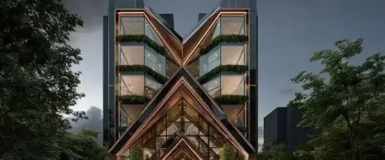 Timber and glass tower framed by trees at dusk